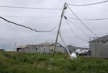 Power poles lean in the village of Newtok, Alaska on Wednesday, Aug. 14, 2024.