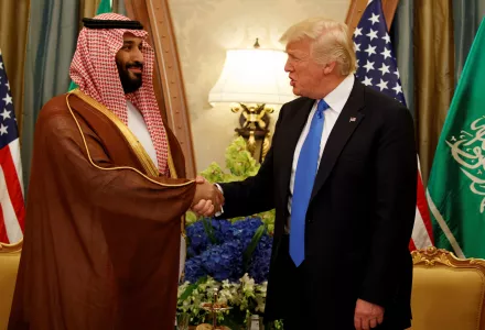 MBS and Donald Trump shaking hands.