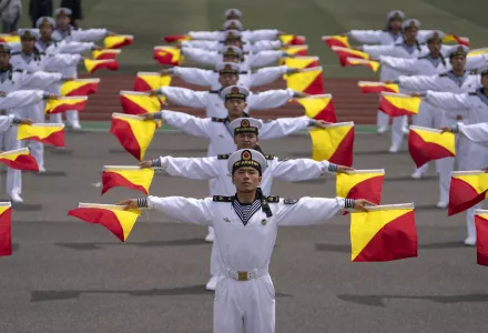 Chinese sailors show flag signaling during a tour arranged for foreign journalists, a day before the opening of the West Pacific Naval Symposium in Qingdao in eastern China's Shandong province, Sunday, April 21, 2024.