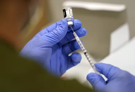 A healthcare worker fills a syringe with the Pfizer COVID-19 vaccine at Jackson Memorial Hospital on Oct. 5, 2021, in Miami. (AP Photo/Lynne Sladky, File)