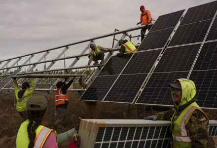 Workers install panels at a solar project May 21, 2025, in Galena, Alaska.