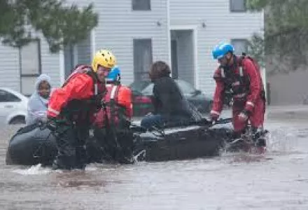 North Carolina emergency services evacuate residents of a neighborhood that fell victim to the flooding caused by Hurricane Matthew in Fayetteville, N.C., Oct 08, 2016.