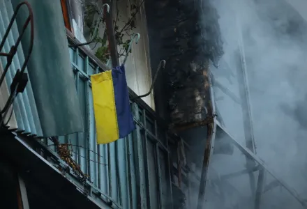 An Ukrainian flag hanging on the balcony is seen after a Russian strike in Zaporizhzhia, Ukraine.