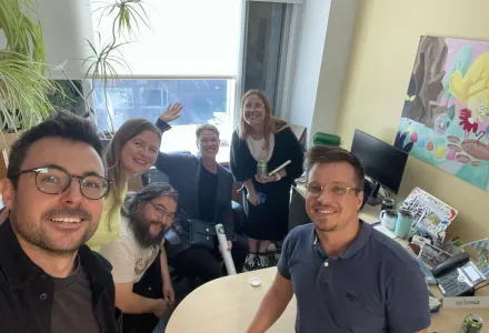 Justin Barnes, Alexandra Middleton, Hans Peder Kirkegaard, Jennifer Spence, Katharina Heinrich, and Juho Kähkönen pose for a selfie in Spence's office.