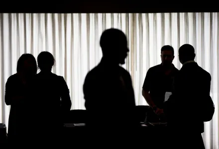 silhouettes of small groups talking