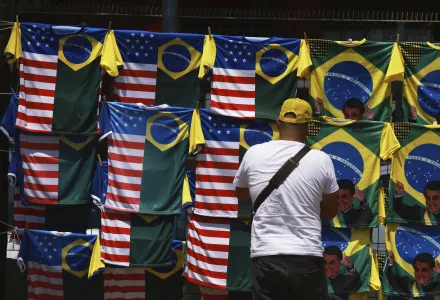 A vendor displays dual flag jerseys featuring the Brazilian and U.S. flag, outside the condominium where former President Jair Bolsonaro is under house arrest in Brasilia