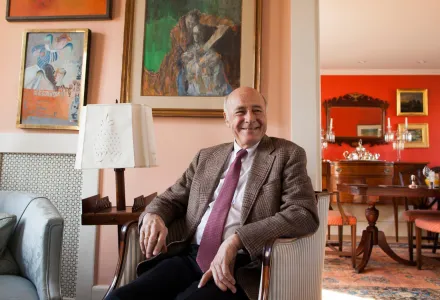 Photo of Joe Nye sitting in a chair, smiling