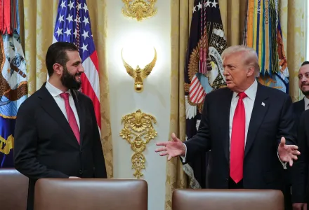 In this photo released by the Syrian Presidency press office, President Donald Trump, right, speaks with Syria's President Ahmad al-Sharaa, at the White House in Washington, Monday, Nov. 10, 2025. (Syrian Presidency press office via AP)
