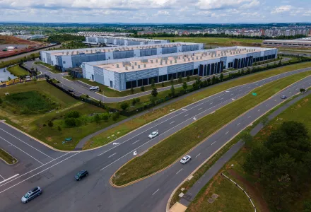Cars drive past data centers that house computer servers and hardware required to support modern internet use, such as artificial intelligence, in Ashburn, Virginia, July 16, 2023.