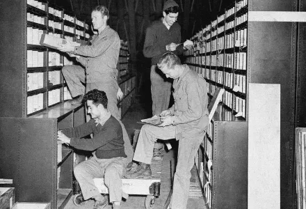 Corporal George Carter, top left, Union, West Virginia; Private Jack Easton, top right, Cokato, Minnesota; Private James Bosica, bottom left, Baltimore, Md., and Technical Sergeant William Cripps, bottom right, Houston, Texas, now with American troops in Great Britain check parts in the stores at the repair and supply depot of the United States Army Air Force Service Command in Britain, August 21, 1942. (Associated Press)