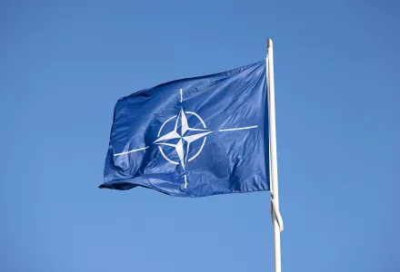 NATO Flag against a blue sky