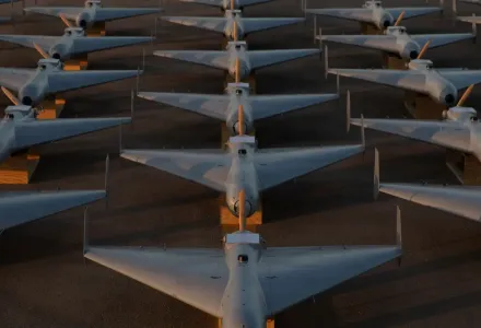 Low-cost Unmanned Combat Attack System (LUCAS) drones are positioned on the tarmac at a base in the U.S. Central Command (CENTCOM) operating area, Nov. 23. The LUCAS platforms are part of a one-way attack drone squadron CENTCOM recently deployed to the Middle East to strengthen regional security and deterrence.