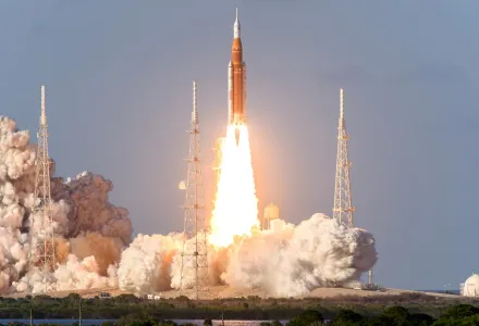 Rocket takes off into the sky. Lots of smoke and gas. The elements of this image furnished by NASA.