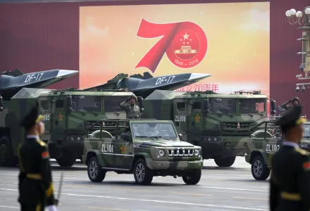 Chinese military vehicles carrying DF-17 ballistic missiles roll during a parade to commemorate the 70th anniversary of the founding of Communist China in Beijing, Tuesday, Oct. 1, 2019. 