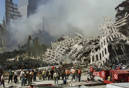 In this Thursday, Sept. 13, 2001 file photo, rescue workers continue their search as smoke rises from the rubble of the World Trade Center in New York.