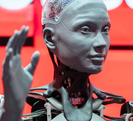 A robot with hand raised 