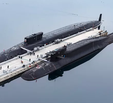 FILE - In this photo released by the Russian Defense Ministry Press Service, the Russian nuclear submarines Prince Vladimir, above, and Yekaterinburg are harbored at a naval base in Gazhiyevo, on the Kola Peninsula in Russia, on April 13, 2021. Russian hawks have called for revising the country's nuclear doctrine to lower the threshold for the use of nuclear weapons, and President Vladimir Putin said the doctrine could be modified. (Russian Defense Ministry Press Service via AP, File)