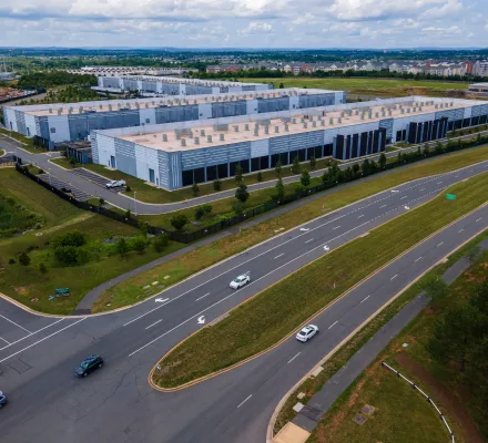 Cars drive past data centers that house computer servers and hardware required to support modern internet use, such as artificial intelligence, in Ashburn, Virginia, July 16, 2023.