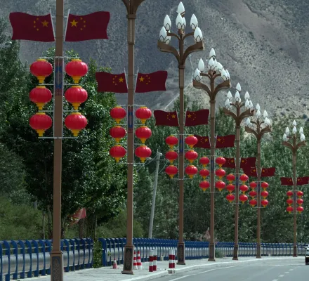 Chinese lanterns and national flags are seen on a road near Shannan City in western China's Tibet autonomous region on July 23, 2026 during a government-organized visit for foreign journalists.(AP Photo/Ng Han Guan)