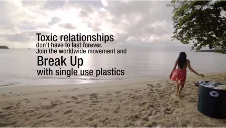 A sample anti-plastic education campaign showing a young woman depositing plastic waste in a recycling bin on a tropical beach, with the caption "Toxic relationships don't have to last forever. Join the worldwide movement and break up with single use plastics."
