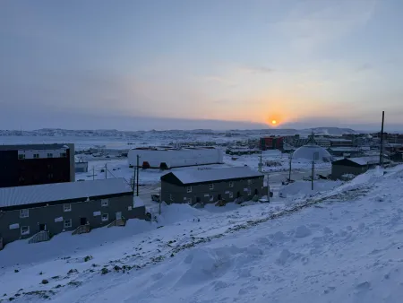 The city of Iqaluit, Nunavut, Canada, at sunset.