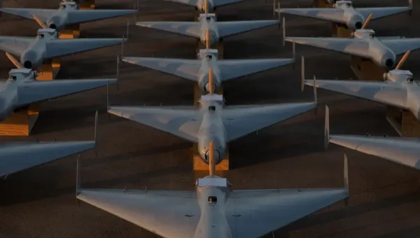 Low-cost Unmanned Combat Attack System (LUCAS) drones are positioned on the tarmac at a base in the U.S. Central Command (CENTCOM) operating area, Nov. 23. The LUCAS platforms are part of a one-way attack drone squadron CENTCOM recently deployed to the Middle East to strengthen regional security and deterrence.