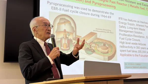 Nobuo Tanaka presents at a podium during a talk at Harvard Kennedy School on October 19, 2026.