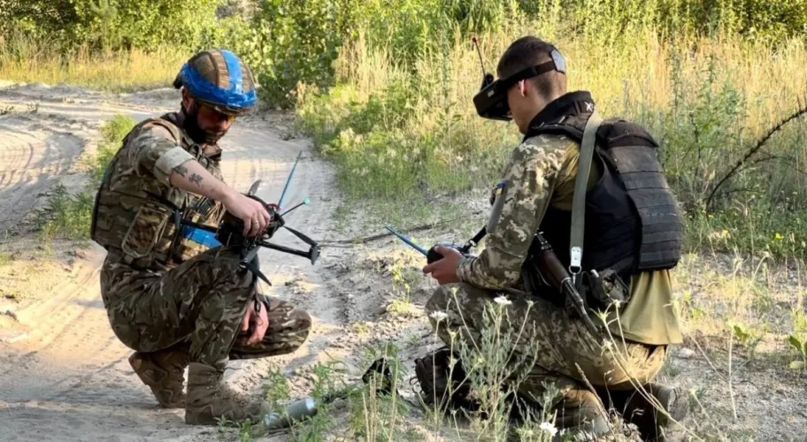 Ukrainian soldiers operate first-person view (FPV) drones to carry out improvised strikes during their efforts to defend against the ongoing Russian invasion.