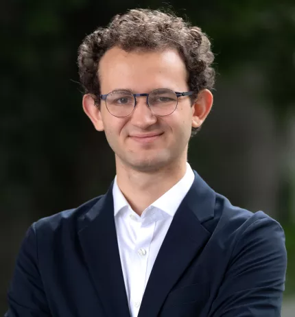 Jason Walter standing in the HKS courtyard.